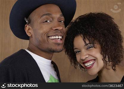 Studio portrait of young couple smiling
