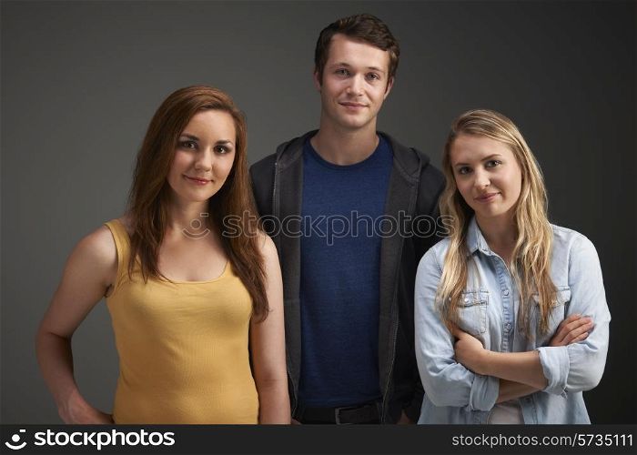 Studio Portrait Of Young Friends Together