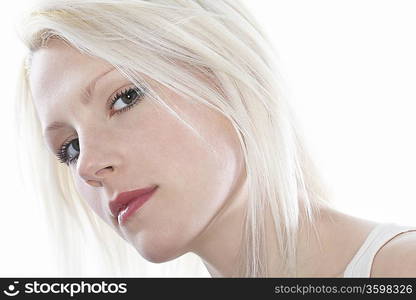 Studio portrait of young woman, close-up