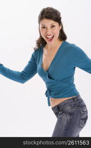 Studio portrait of young woman dancing