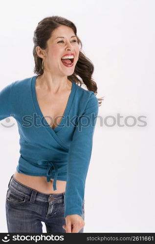 Studio portrait of young woman dancing