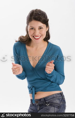 Studio portrait of young woman dancing