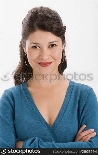 Studio portrait of young woman looking at camera