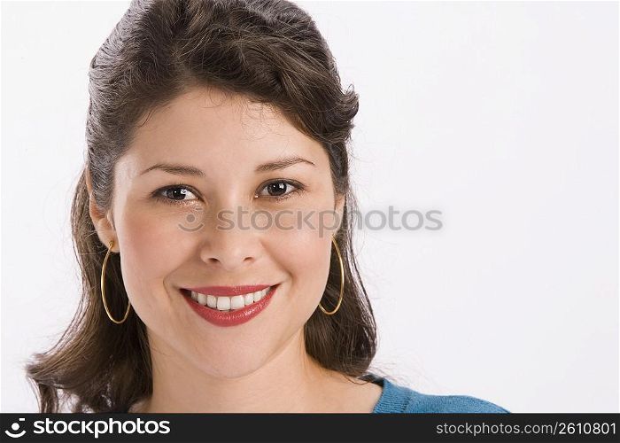 Studio portrait of young woman looking at camera