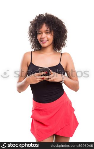 Studio shot: beautiful african woman with a smartphone