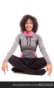 Studio shot of a beautiful african woman exercising