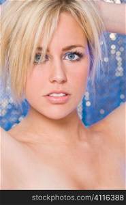 Studio shot of a beautiful blond haired blue eyed female model