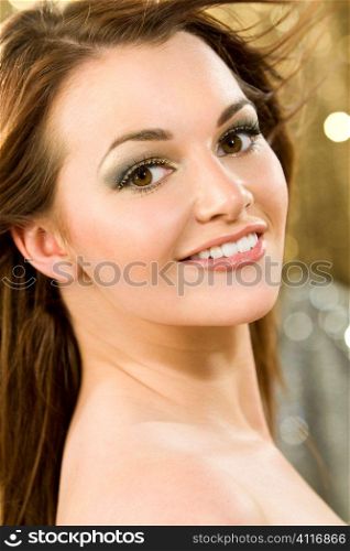 Studio shot of a beautiful young brunette woman with striking brown eyes