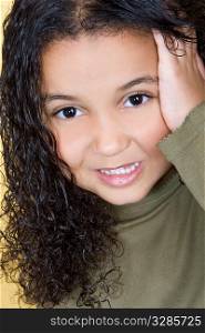 Studio shot of a beautiful young mixed race girl looking cute