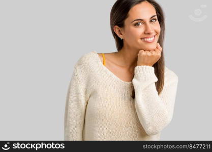 Studio shot of a beautiful young woman smiling