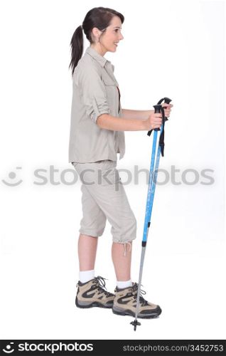 Studio shot of a female walker with poles