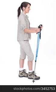 Studio shot of a female walker with poles