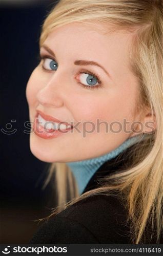 Studio shot of a smartly dressed, beautiful, blond haired blue eyed female model