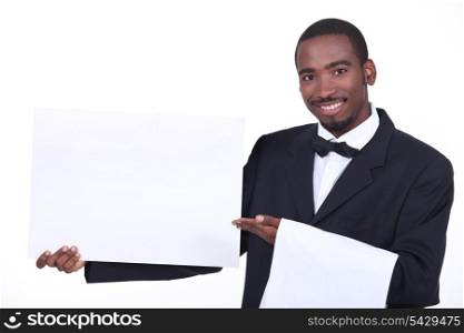 Studio shot of a waiter with a board left blank for your image