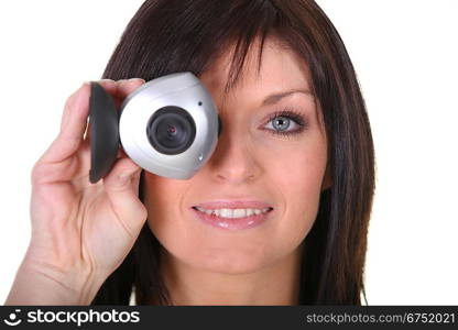 Studio shot of a woman with a webcam