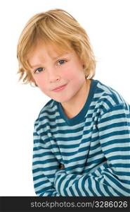 Studio shot of a young blond haired blue eyed boy