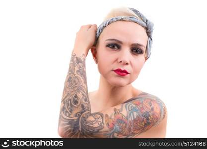Studio shot of a young tattooed woman
