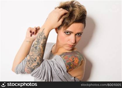 Studio shot of a young tattooed woman