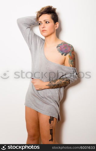 Studio shot of a young tattooed woman