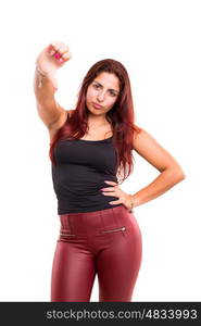 Studio shot of a young woman signaling thumbs down