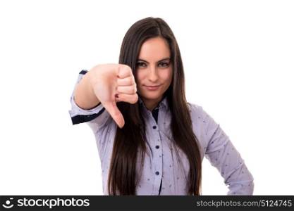 Studio shot of a young woman signaling thumbs down