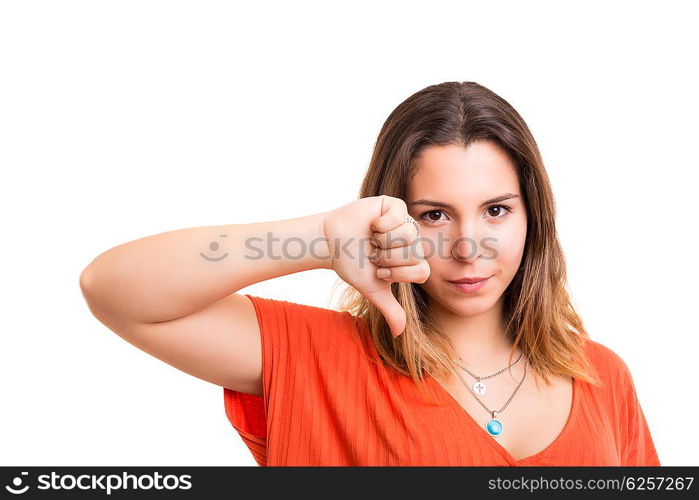 Studio shot of a young woman signaling thumbs down
