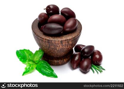 studio shot of black olives in wooden bowl isolated on white background. black olives isolated in wooden bowl on white background