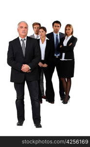 Studio shot of businessman and his team