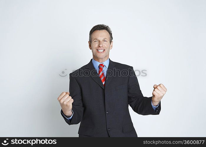 Studio shot of businessman with laptop