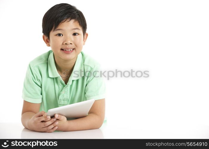 Studio Shot Of Chinese Boy With Digital Tablet