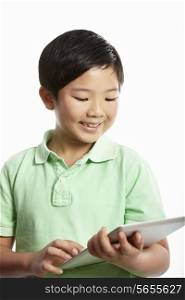 Studio Shot Of Chinese Boy With Digital Tablet