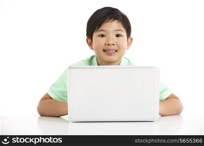 Studio Shot Of Chinese Boy With Laptop
