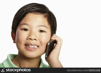 Studio Shot Of Chinese Boy With Mobile Phone