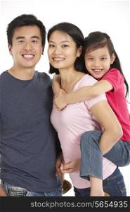 Studio Shot Of Chinese Family