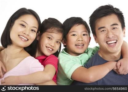 Studio Shot Of Chinese Family