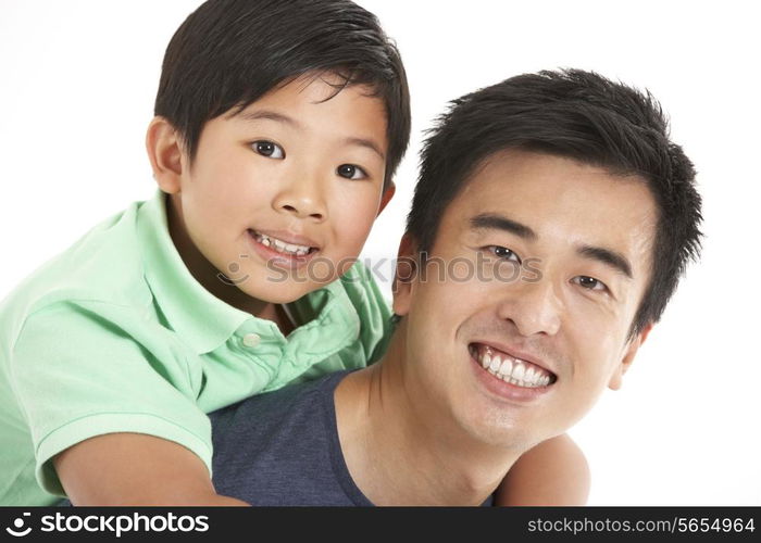 Studio Shot Of Chinese Father And Son