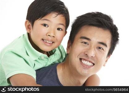 Studio Shot Of Chinese Father And Son