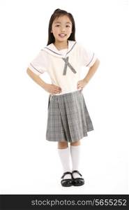 Studio Shot Of Chinese Girl In School Uniform