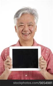 Studio Shot Of Chinese Senior Man Holding Digital Tablet