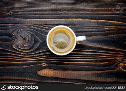studio shot of cup of coffee on wooden background. cup of coffee on wooden background