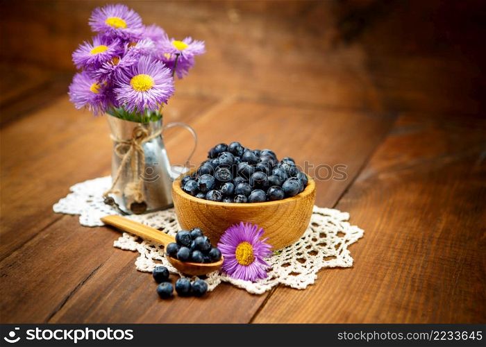 Studio shot of fresh natural blueberries on wooden background. Studio shot of Fresh blueberries