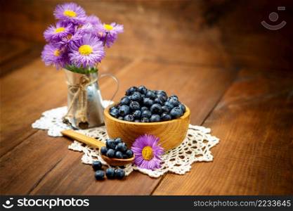 Studio shot of fresh natural blueberries on wooden background. Studio shot of Fresh blueberries