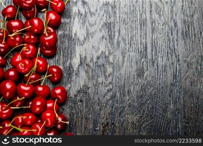 Studio shot of fresh natural cherries on wooden background. Studio shot of Fresh cherries
