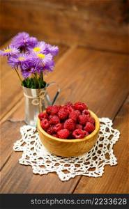 Studio shot of fresh natural raspberries on wooden background. Studio shot of Fresh raspberries