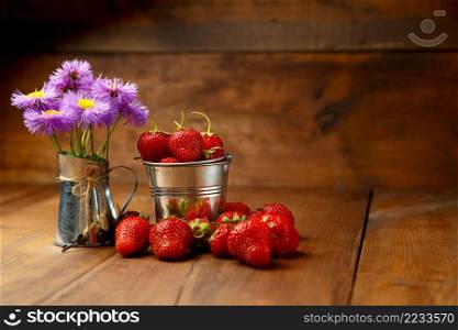 Studio shot of fresh natural strawberries on wooden background. Fresh strawberries