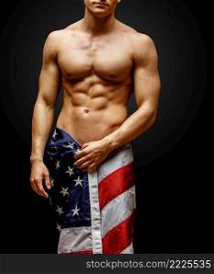 Studio shot of Handsome young man’s torso. Handsome young man’s torso covered with american flag