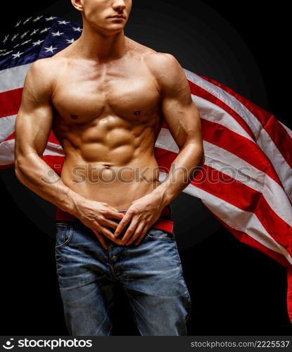 Studio shot of Handsome young man’s torso. Handsome young man’s torso covered with american flag