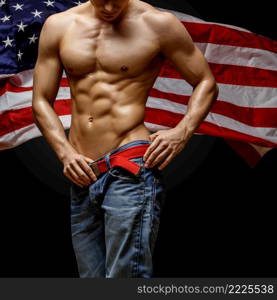 Studio shot of Handsome young man’s torso. Handsome young man’s torso covered with american flag