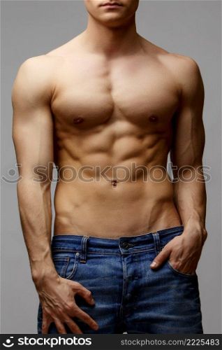 Studio shot of Handsome young man’s torso. Handsome young man’s torso
