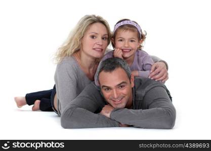 Studio shot of parents with their daughter